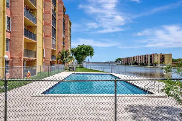a view of swimming pool with a yard