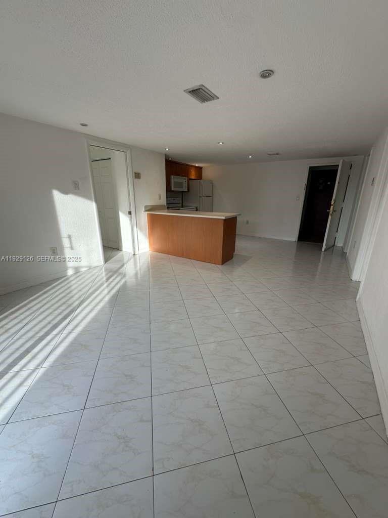 4801 Northwest 7th Street, Unit 21016 Miami, FL 33126 - Photo 7 of 18 a living room with a furniture