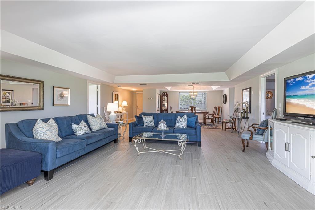 213 Memory Lane, Unit 4 Naples, FL 34112 - Photo 14 of 20 Living area with wood finish floors