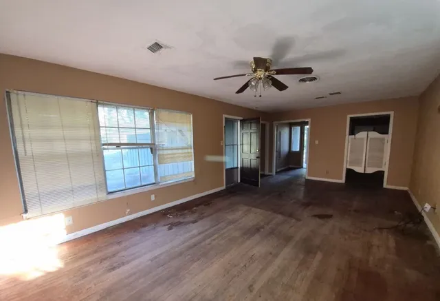 a view of an empty room with a window
