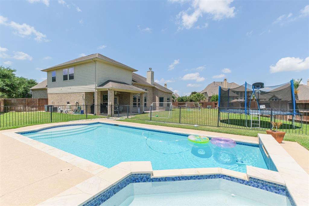 This home has a huge yard with a relaxing pool and spa!