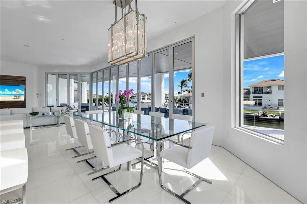 260 Channel Drive Naples, FL 34108 - Photo 11 of 48 a view of a livingroom and dining room