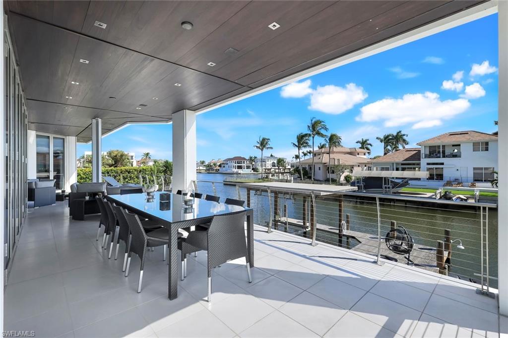 260 Channel Drive Naples, FL 34108 - Photo 13 of 48 a view of a dining room with furniture window and outside view