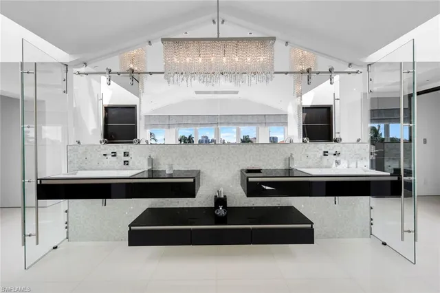 a kitchen with stainless steel appliances kitchen island granite countertop a refrigerator and stove