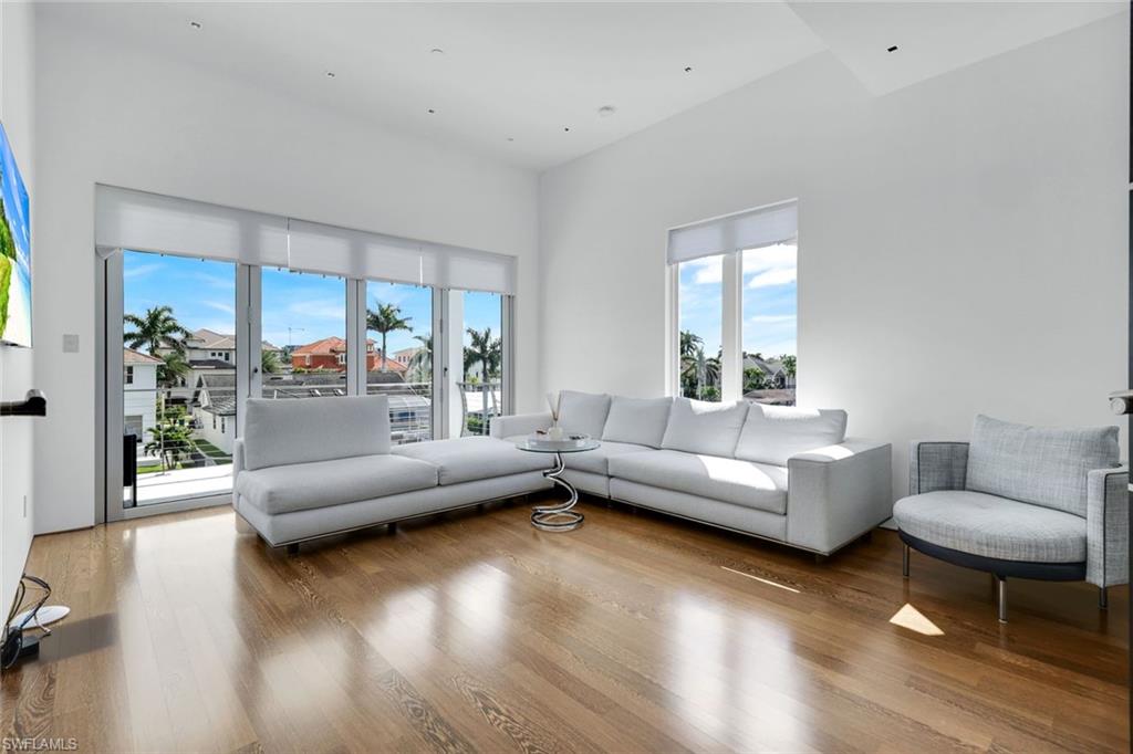 260 Channel Drive Naples, FL 34108 - Photo 28 of 48 a living room with furniture and a large window