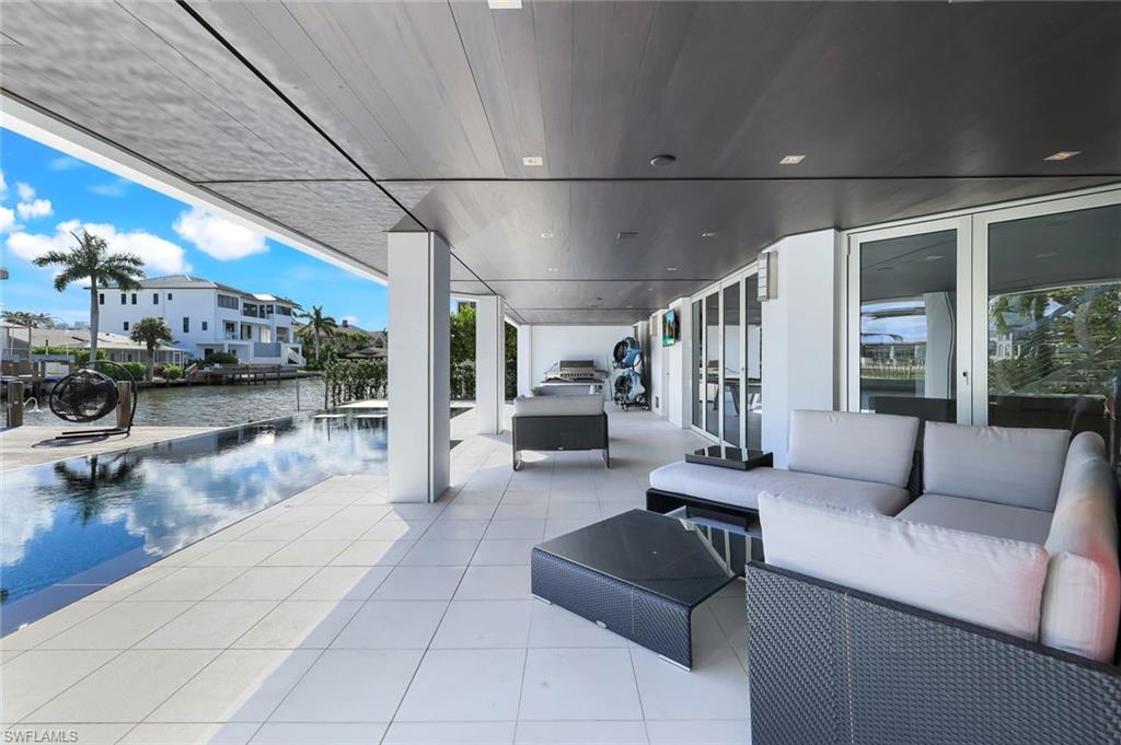 260 Channel Drive Naples, FL 34108 - Photo 36 of 48 a living room with furniture and a large window