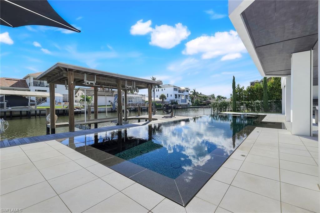 260 Channel Drive Naples, FL 34108 - Photo 38 of 48 a outdoor view with a sitting space