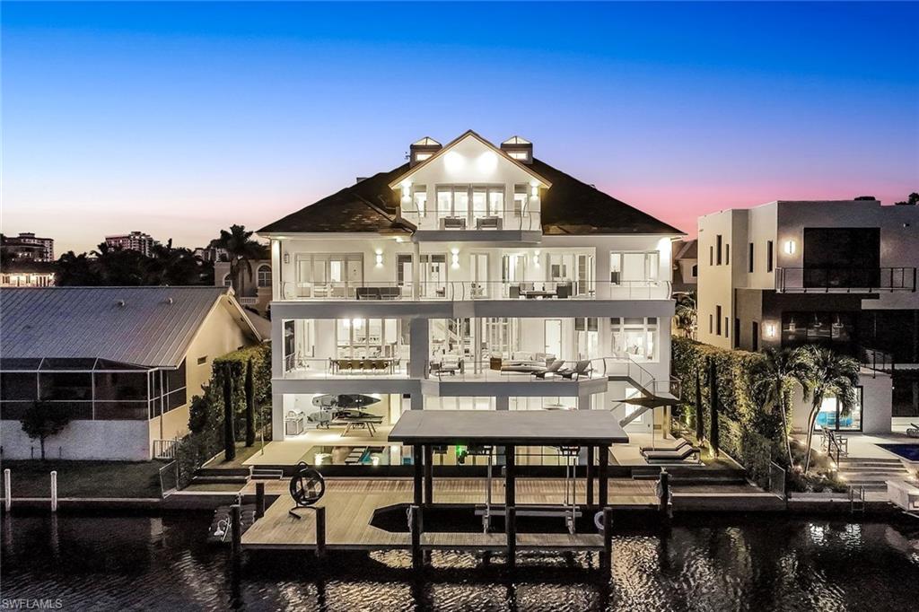 260 Channel Drive Naples, FL 34108 - Photo 44 of 48 a view of a house with swimming pool and sitting area