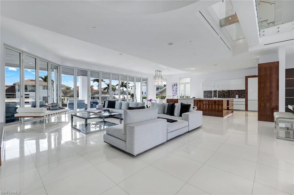 260 Channel Drive Naples, FL 34108 - Photo 5 of 48 a living room with furniture and a large window