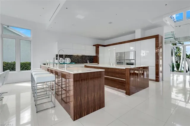a kitchen with kitchen island cabinets and a sink