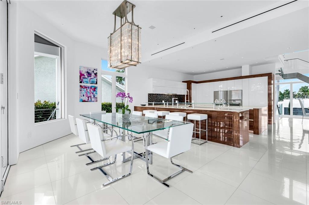 260 Channel Drive Naples, FL 34108 - Photo 10 of 48 a view of kitchen with microwave and cabinets