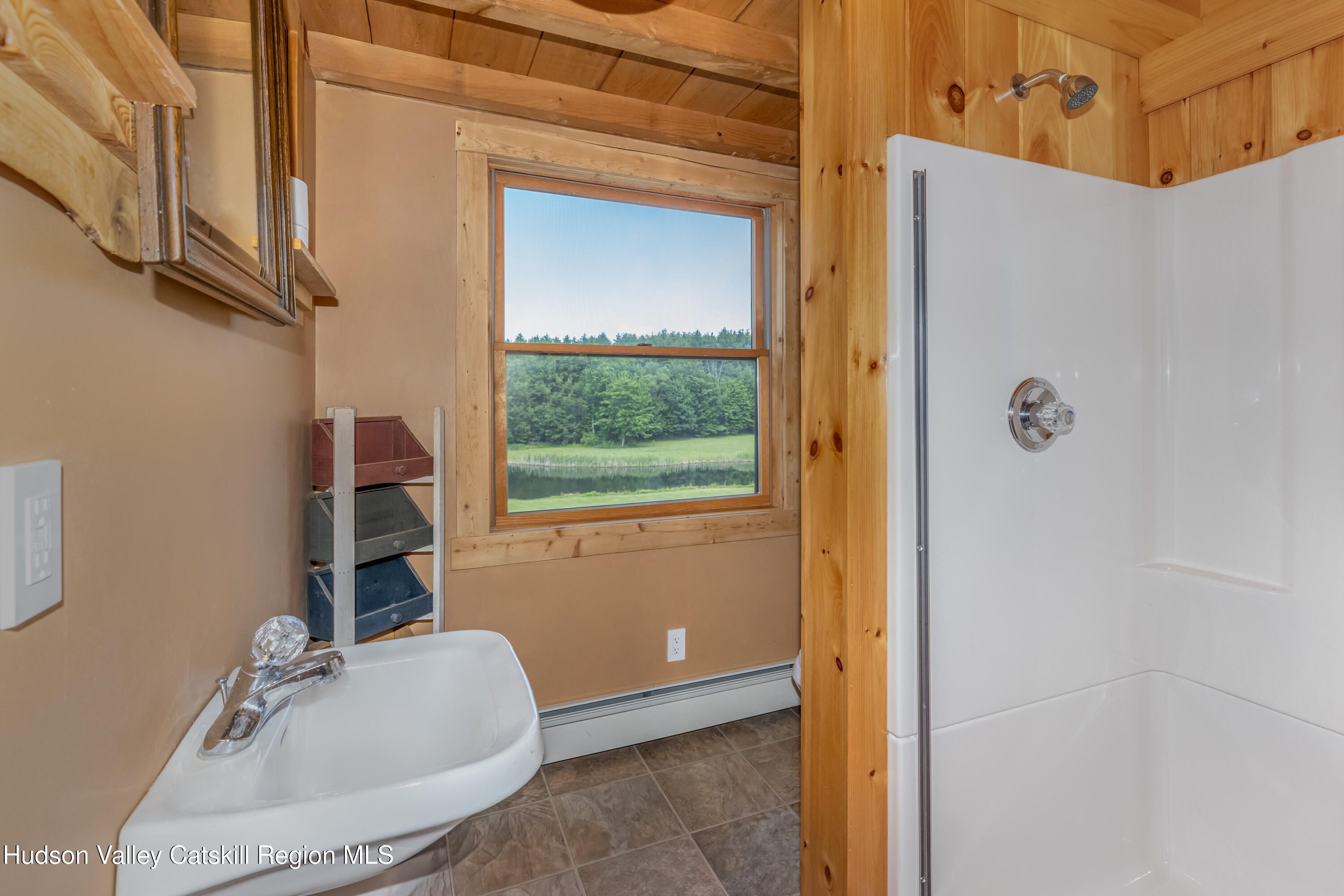 688 Bruce Porn Road Gilboa, NY 12167 - Photo 77 of 104 a bathroom with a sink and a mirror