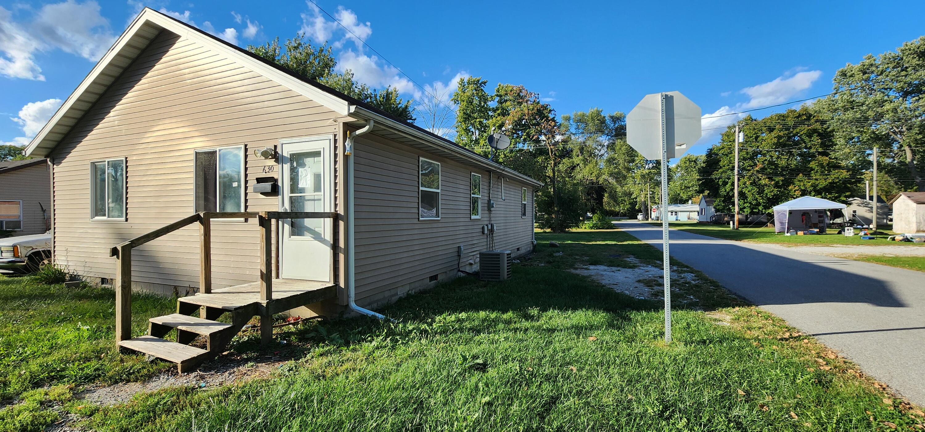 630 East Elm Street Rensselaer, IN 47978 - Photo 2 of 14 a view of a house with backyard and sitting area