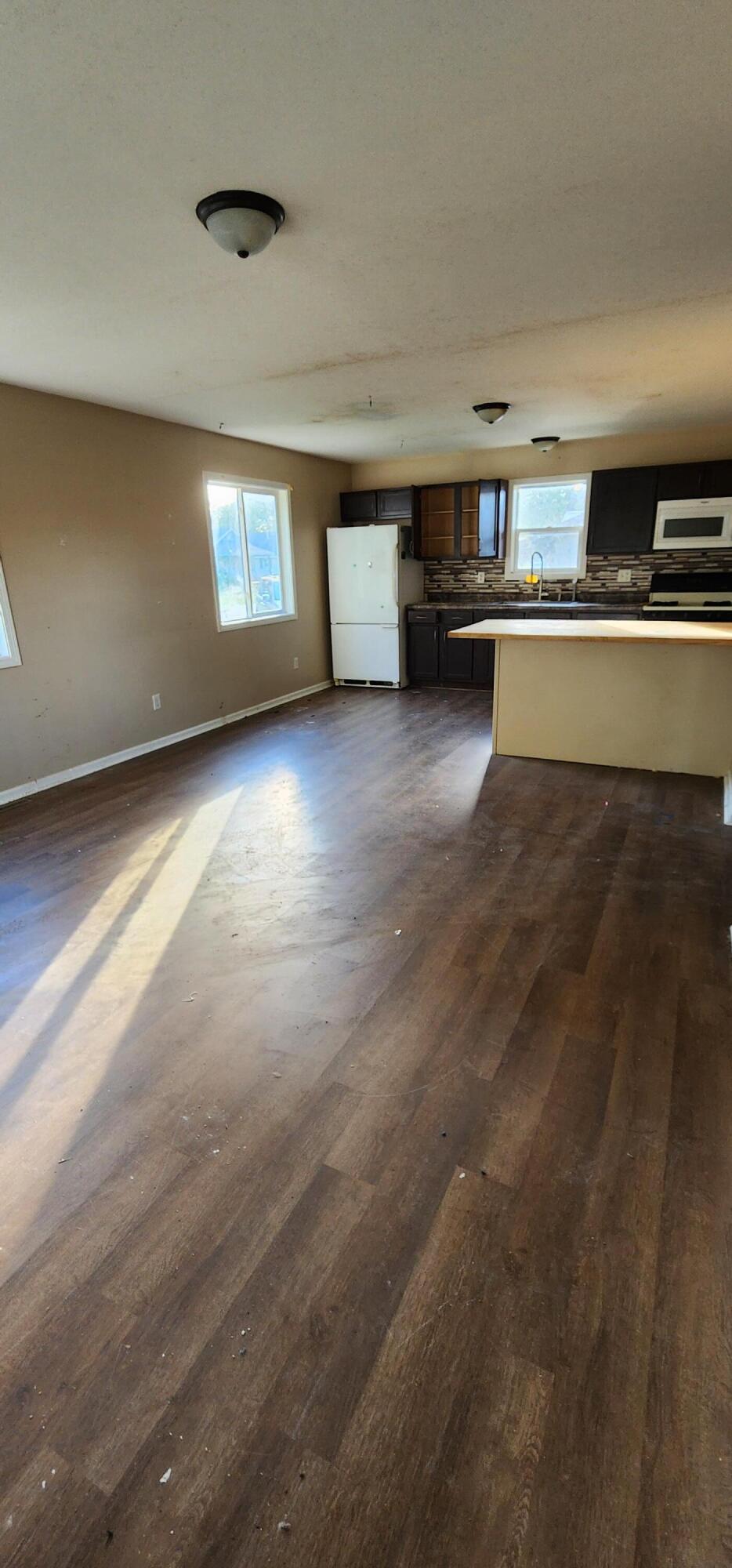 630 East Elm Street Rensselaer, IN 47978 - Photo 7 of 14 a view of kitchen with cabinets and window