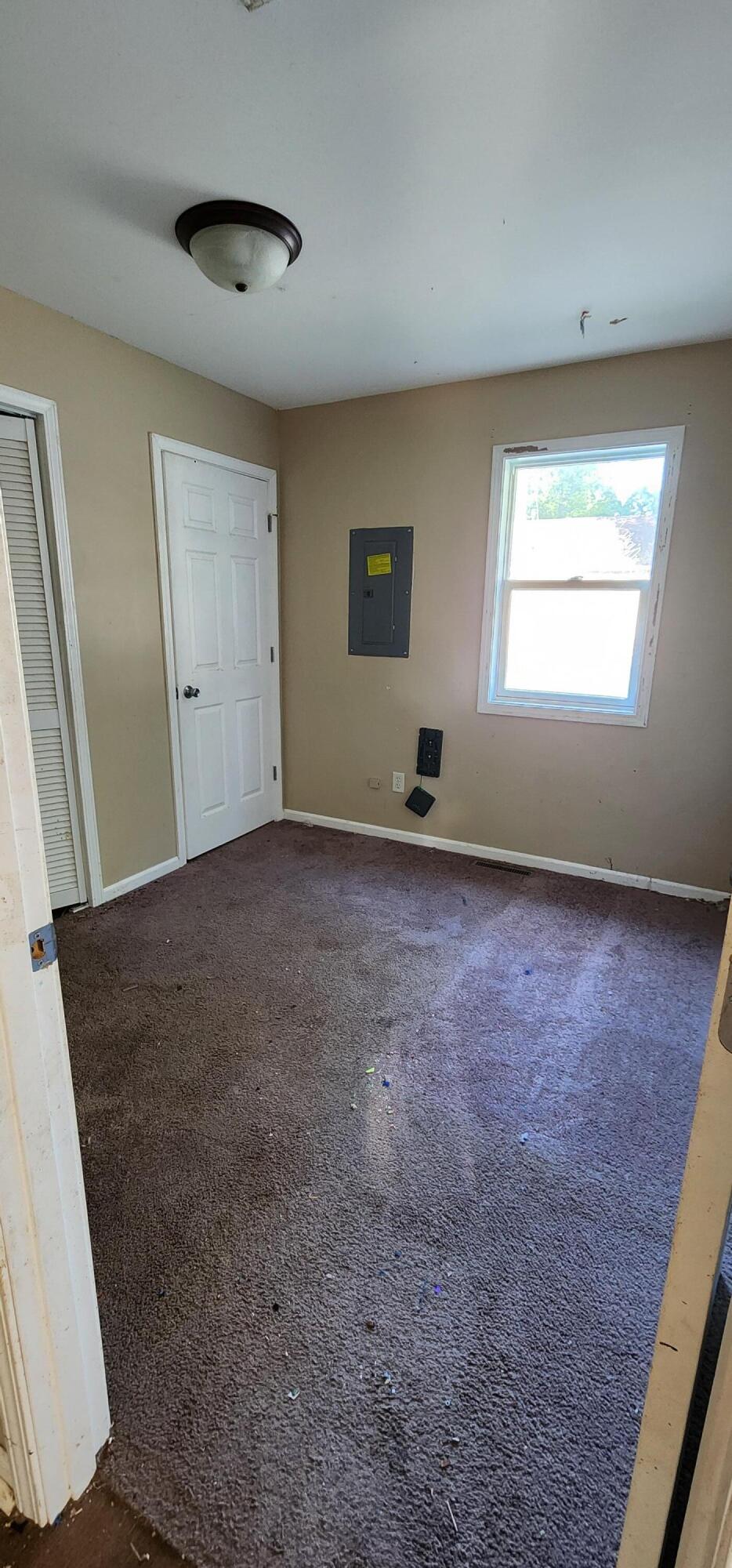 630 East Elm Street Rensselaer, IN 47978 - Photo 8 of 14 an empty room with windows