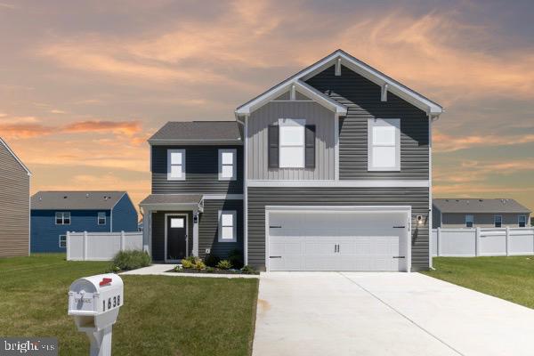 1638 Terrapin Circle Cambridge, MD 21613 - Photo 1 of 25 a front view of a house with garden