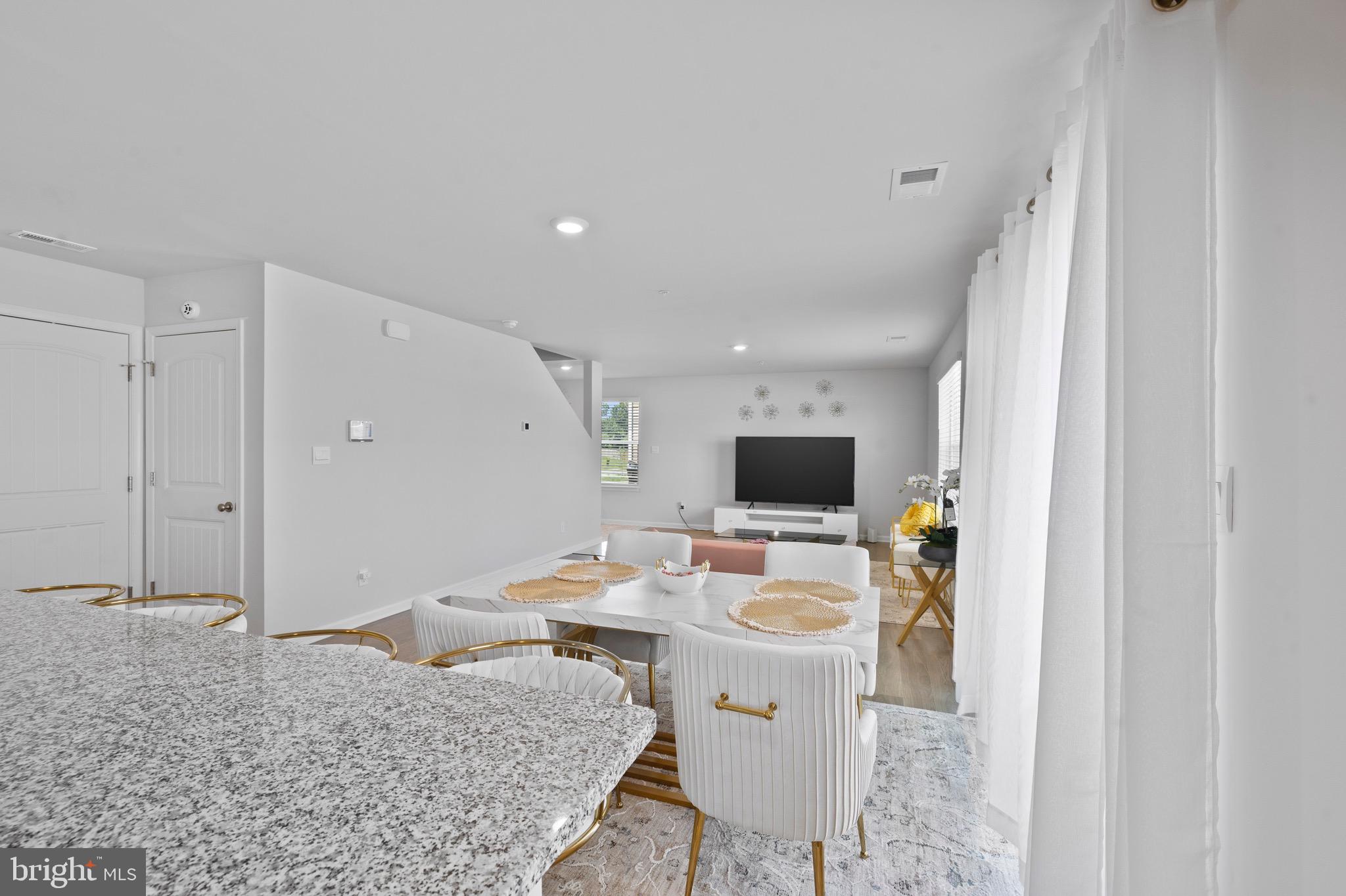 1638 Terrapin Circle Cambridge, MD 21613 - Photo 12 of 25 a bedroom with a bed and a flat screen tv