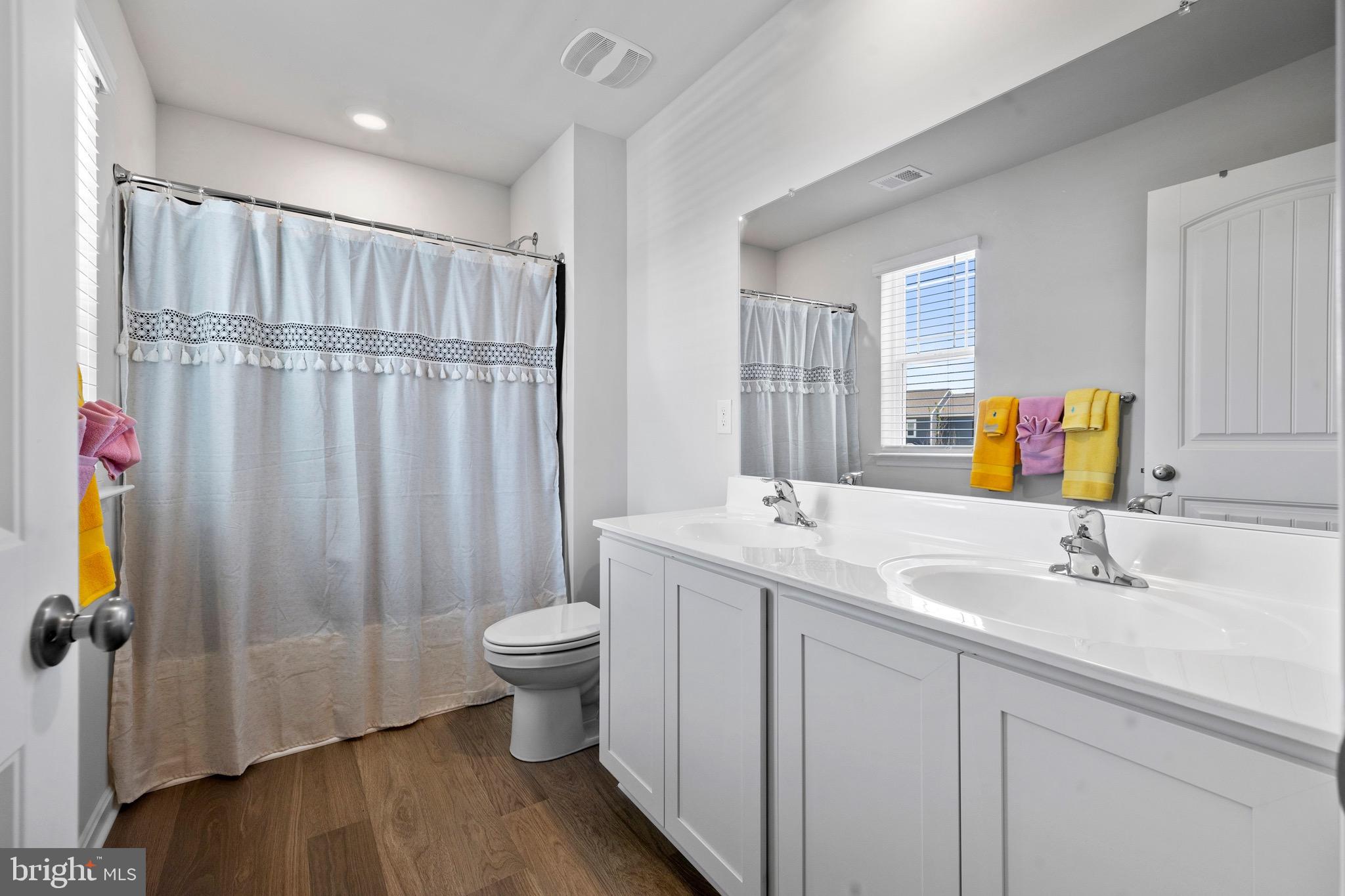 1638 Terrapin Circle Cambridge, MD 21613 - Photo 15 of 25 a bathroom with a sink toilet and shower