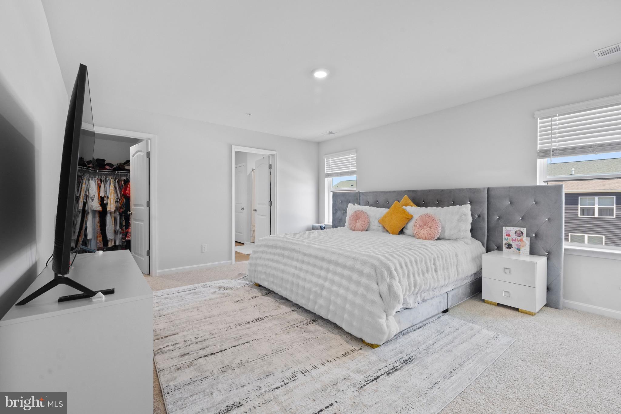 1638 Terrapin Circle Cambridge, MD 21613 - Photo 19 of 25 a bedroom with a bed and wooden floor