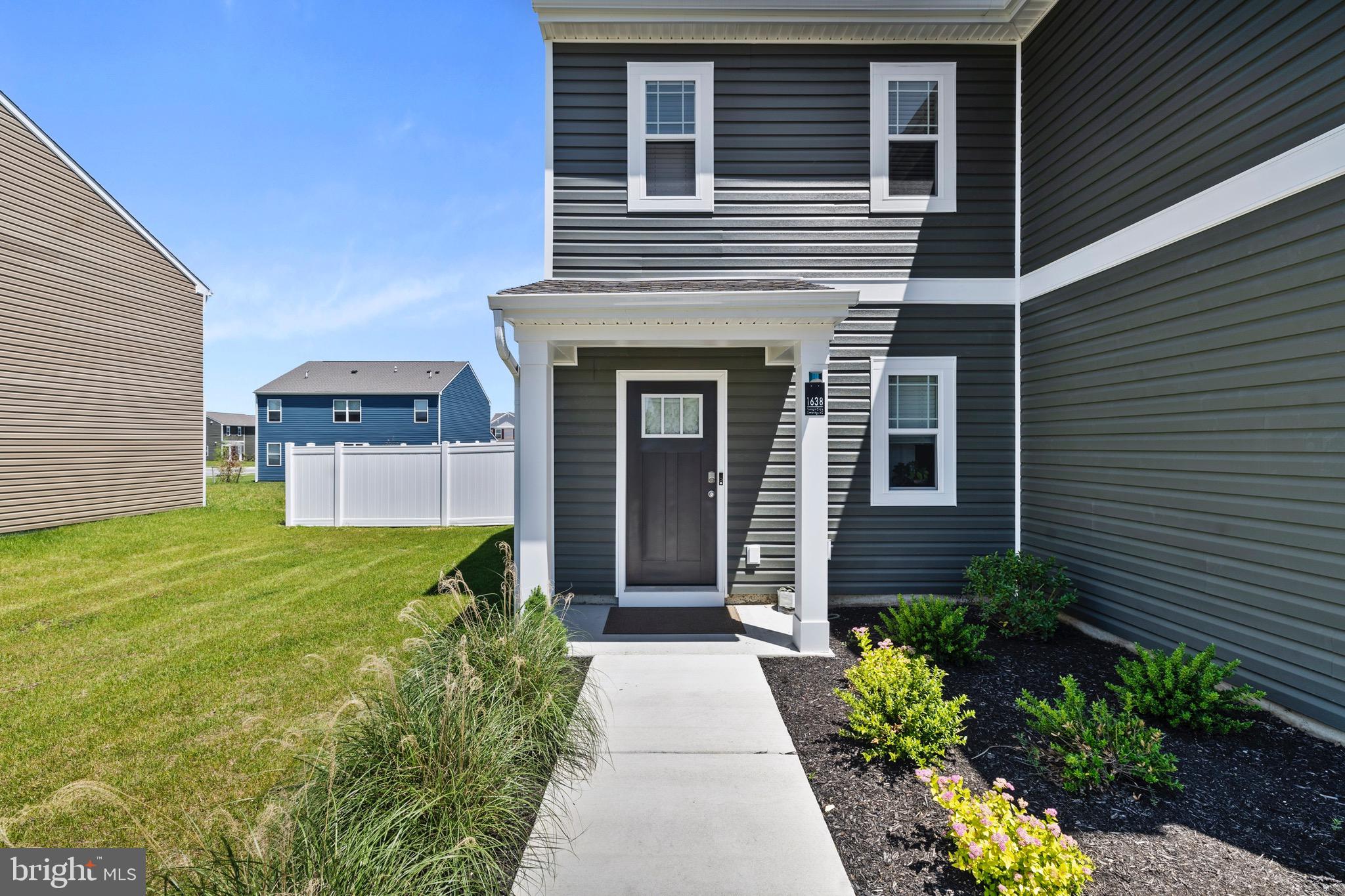 1638 Terrapin Circle Cambridge, MD 21613 - Photo 25 of 25 a front view of a house with garden