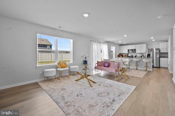 1638 Terrapin Circle Cambridge, MD 21613 - Photo 5 of 25 a living room with furniture and a table
