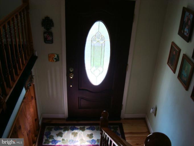 1627 Bay Ridge Road Edgewater, MD 21037 - Photo 13 of 21 a bathroom with a toilet and a mirror
