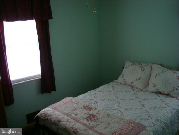 1627 Bay Ridge Road Edgewater, MD 21037 - Photo 3 of 21 a bedroom with a bed and a window
