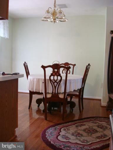 1627 Bay Ridge Road Edgewater, MD 21037 - Photo 7 of 21 a view of a dining room with furniture and wooden floor