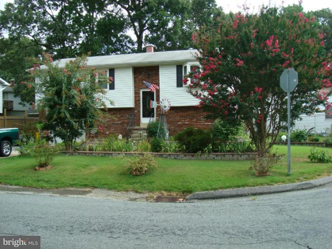 1627 Bay Ridge Road Edgewater, MD 21037 - Photo 8 of 21 a front view of a house with a yard and a garage