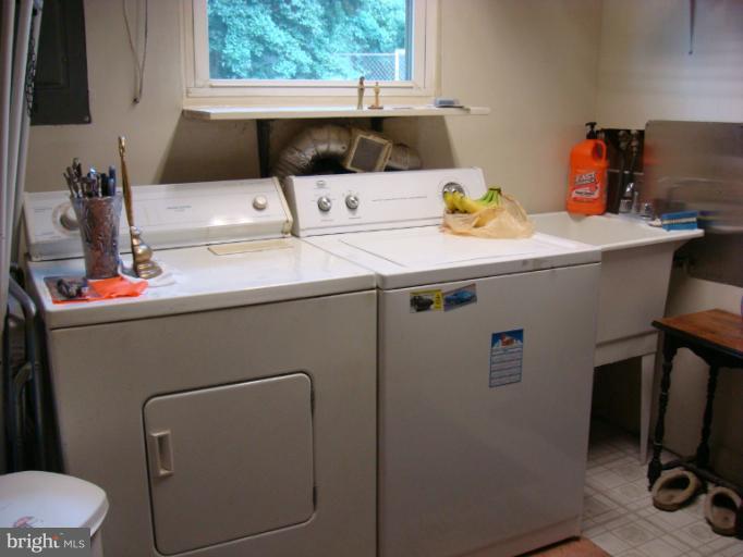 1627 Bay Ridge Road Edgewater, MD 21037 - Photo 9 of 21 a bathroom with a sink toilet and vanity