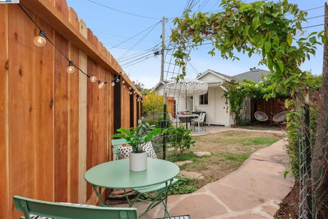 a patio with a table and chairs