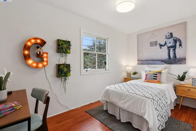 a bedroom with a bed and a chair