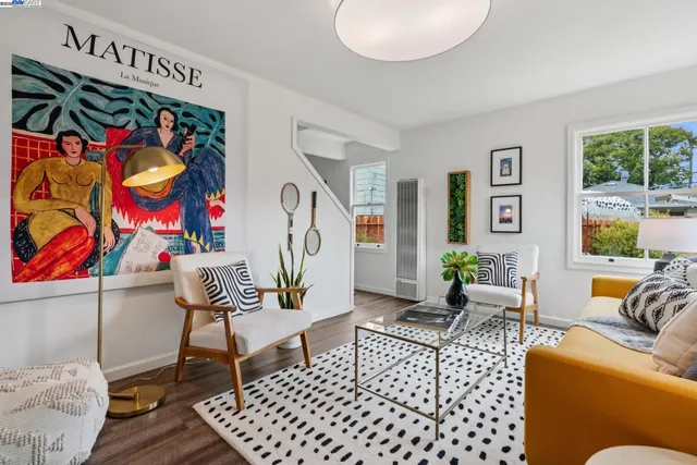 a living room with furniture and a rug