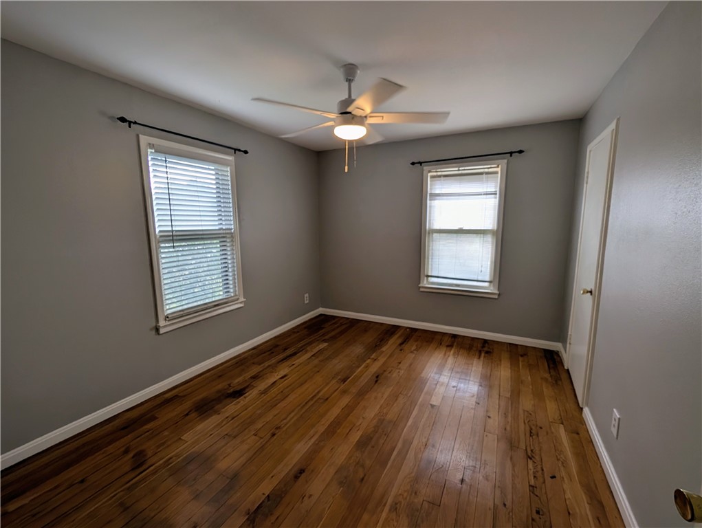 3561 Monterrey Street Corpus Christi, TX 78411 - Photo 16 of 21 wooden floor in an empty room with a window