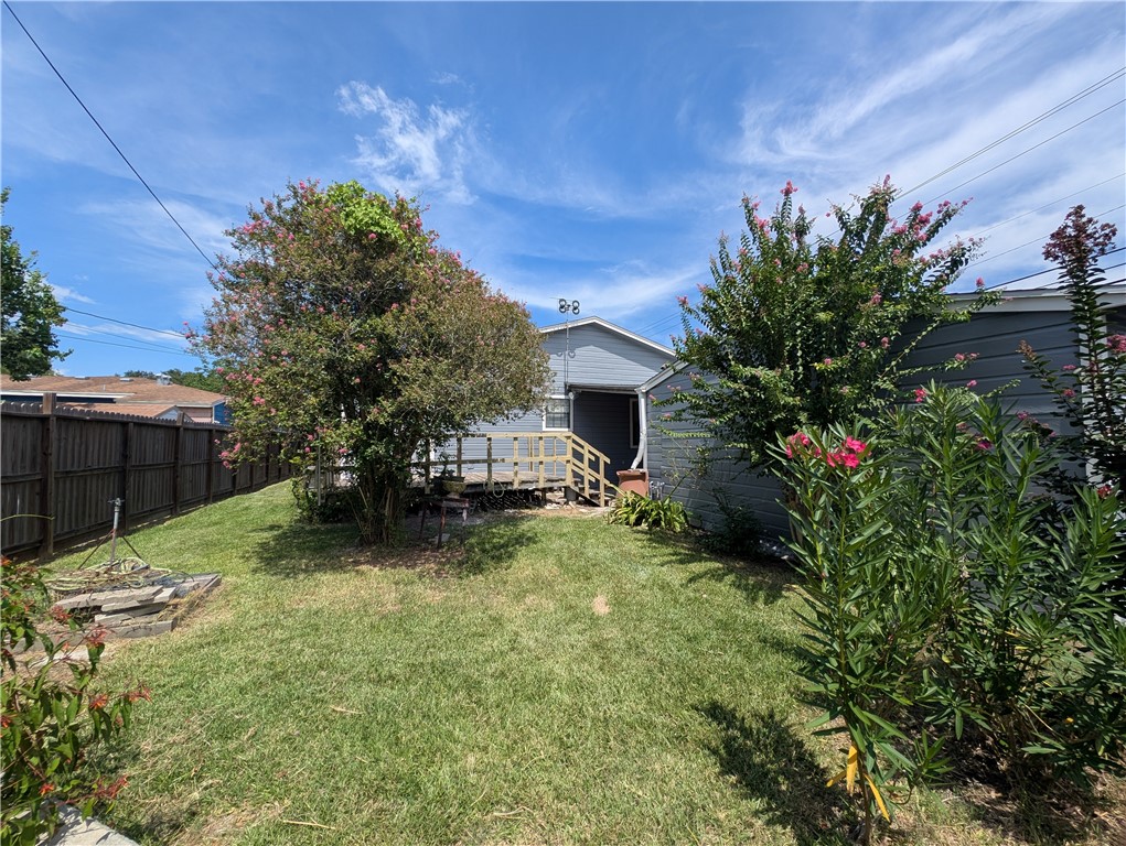 3561 Monterrey Street Corpus Christi, TX 78411 - Photo 19 of 21 a view of a backyard with plants and a patio