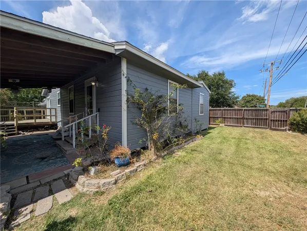 a house view with a backyard