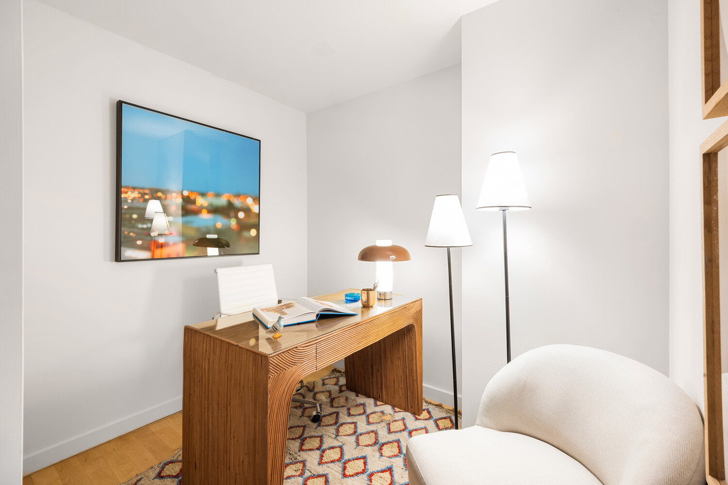 425 East 13th Street, Unit 2B Manhattan, NY 10009 - Photo 6 of 17 a living room with furniture and a lamp