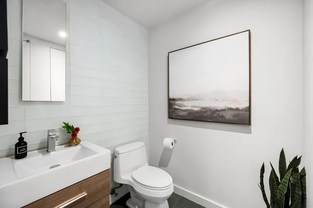 a living room with furniture and a lamp