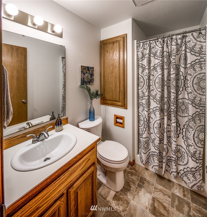 1404 Welling Road Bellingham, WA 98226 - Photo 13 of 21 a bathroom with a sink toilet and shower