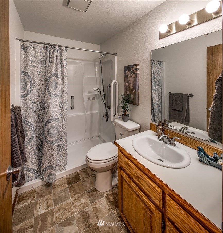 1404 Welling Road Bellingham, WA 98226 - Photo 16 of 21 a bathroom with a sink toilet and shower