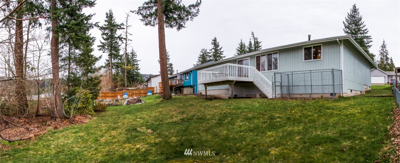 1404 Welling Road Bellingham, WA 98226 - Photo 20 of 21 a view of a house with a yard and trees