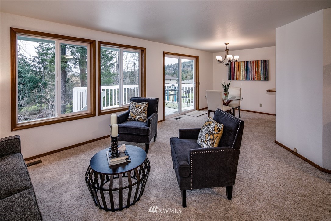 1404 Welling Road Bellingham, WA 98226 - Photo 5 of 21 a living room with furniture and floor to ceiling windows