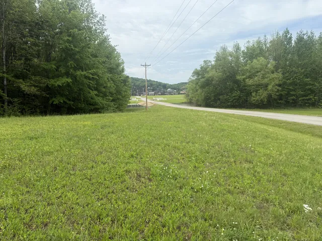 a view of a field with an outdoor space
