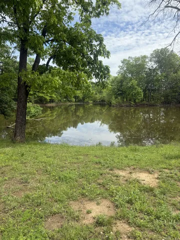a view of a lake with a yard