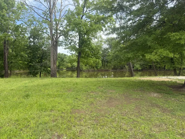 a view of outdoor space with deck and yard