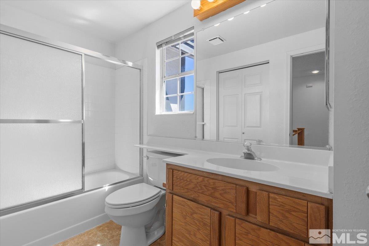 989 Ridgeview Drive Reno, NV 89511 - Photo 18 of 20 a bathroom with a sink toilet and shower