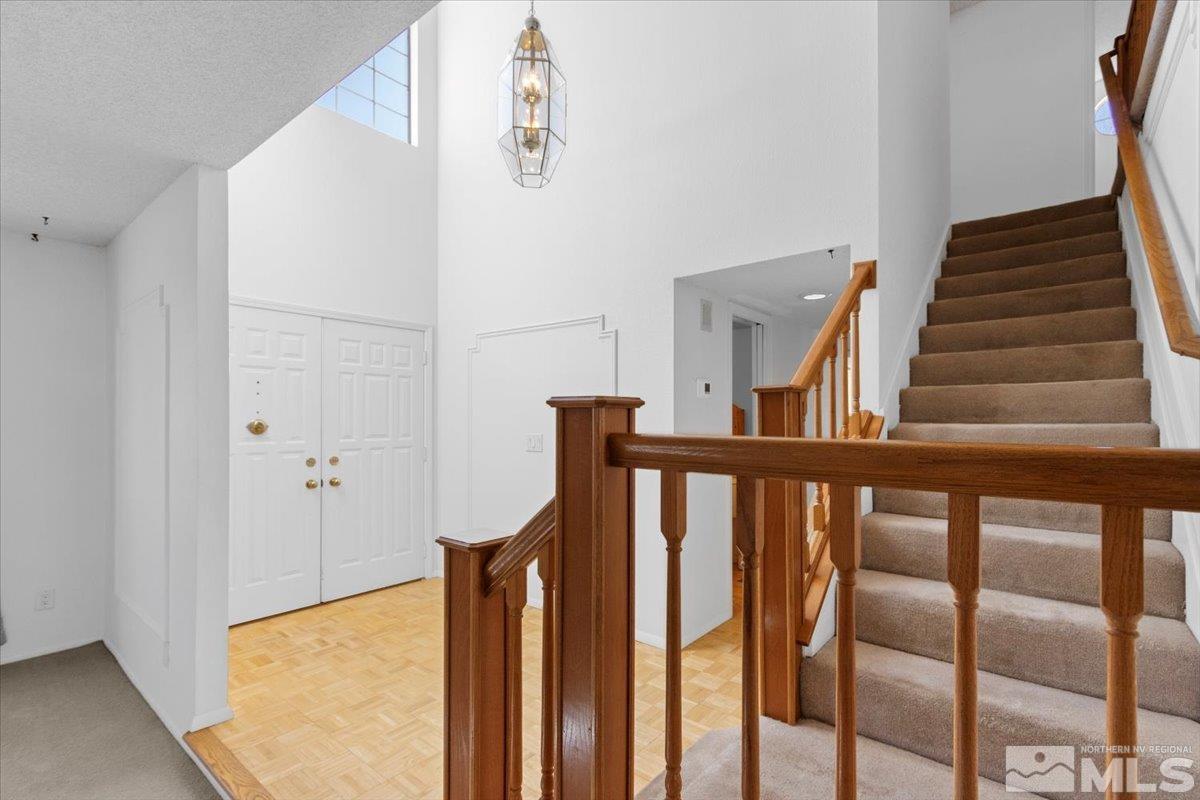 989 Ridgeview Drive Reno, NV 89511 - Photo 2 of 20 a view of staircase with railing and white walls