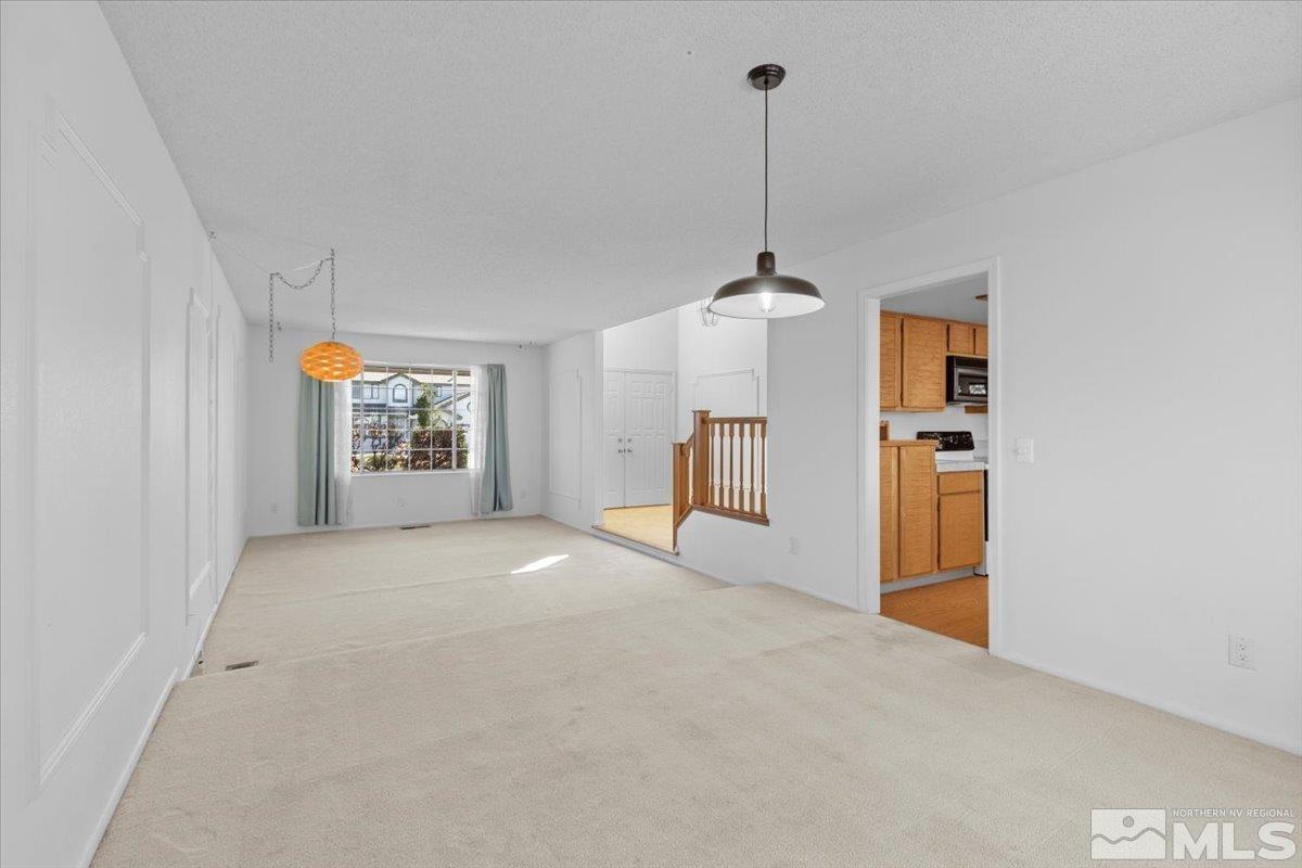 989 Ridgeview Drive Reno, NV 89511 - Photo 6 of 20 a view of empty room with windows