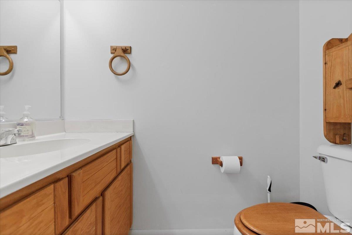 989 Ridgeview Drive Reno, NV 89511 - Photo 8 of 20 a bathroom with a sink vanity mirror and toilet