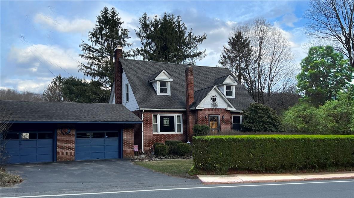 1663 Gulf Road Callicoon Center, NY 12724 - Photo 1 of 1 a front view of a house with a garden